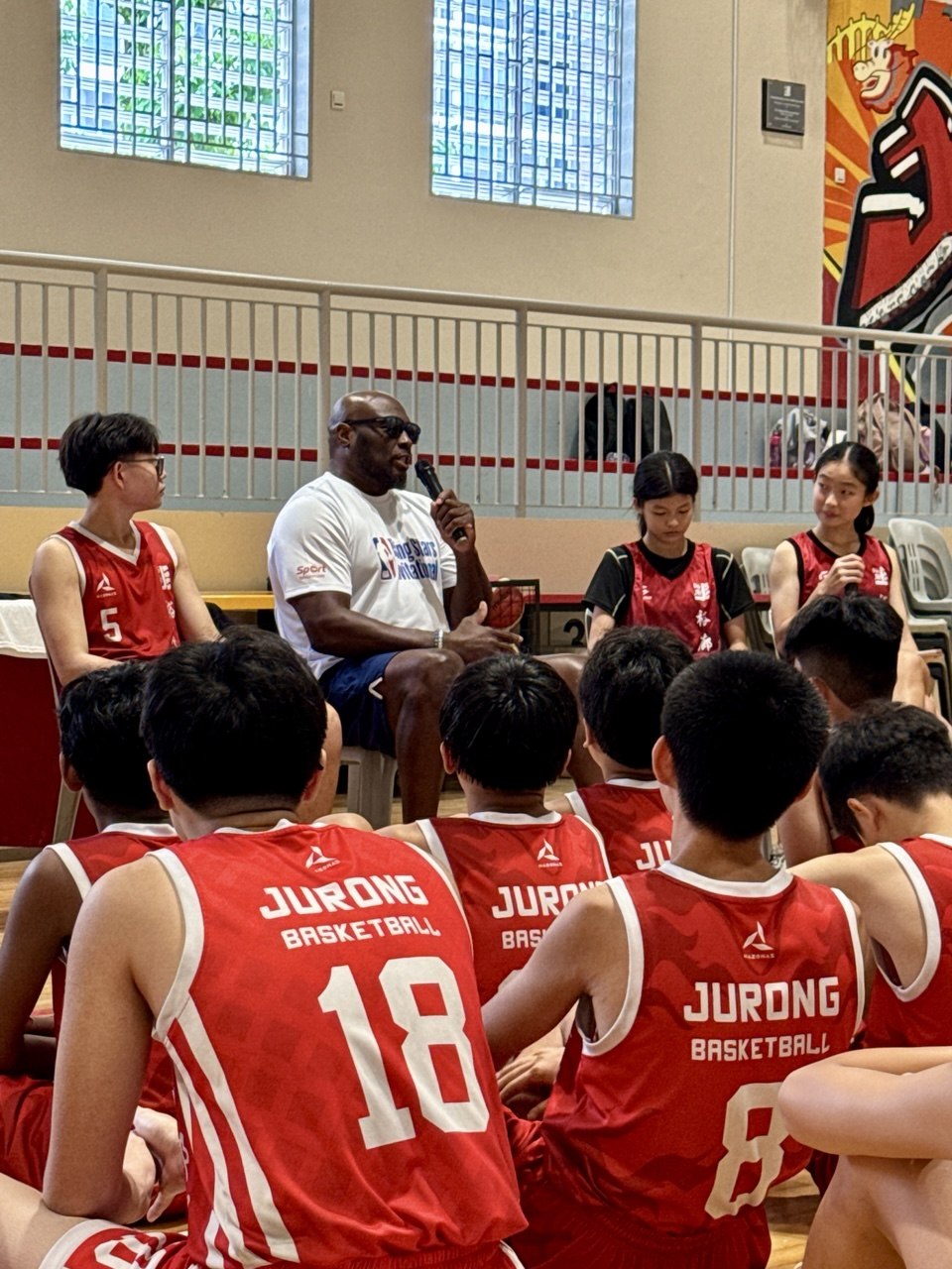 Courtside coaching, mic in hand — NBA Rising Stars Invitational, Singapore 2026